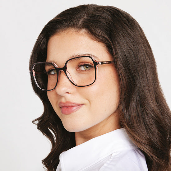 Guess women’s eyeglasses with oversized brown frame, modern and feminine style.